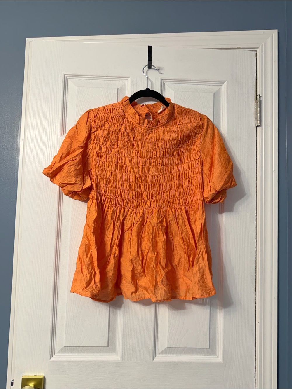 Jodifl vibrant orange short-sleeve top featuring an all-over smocked bodice and